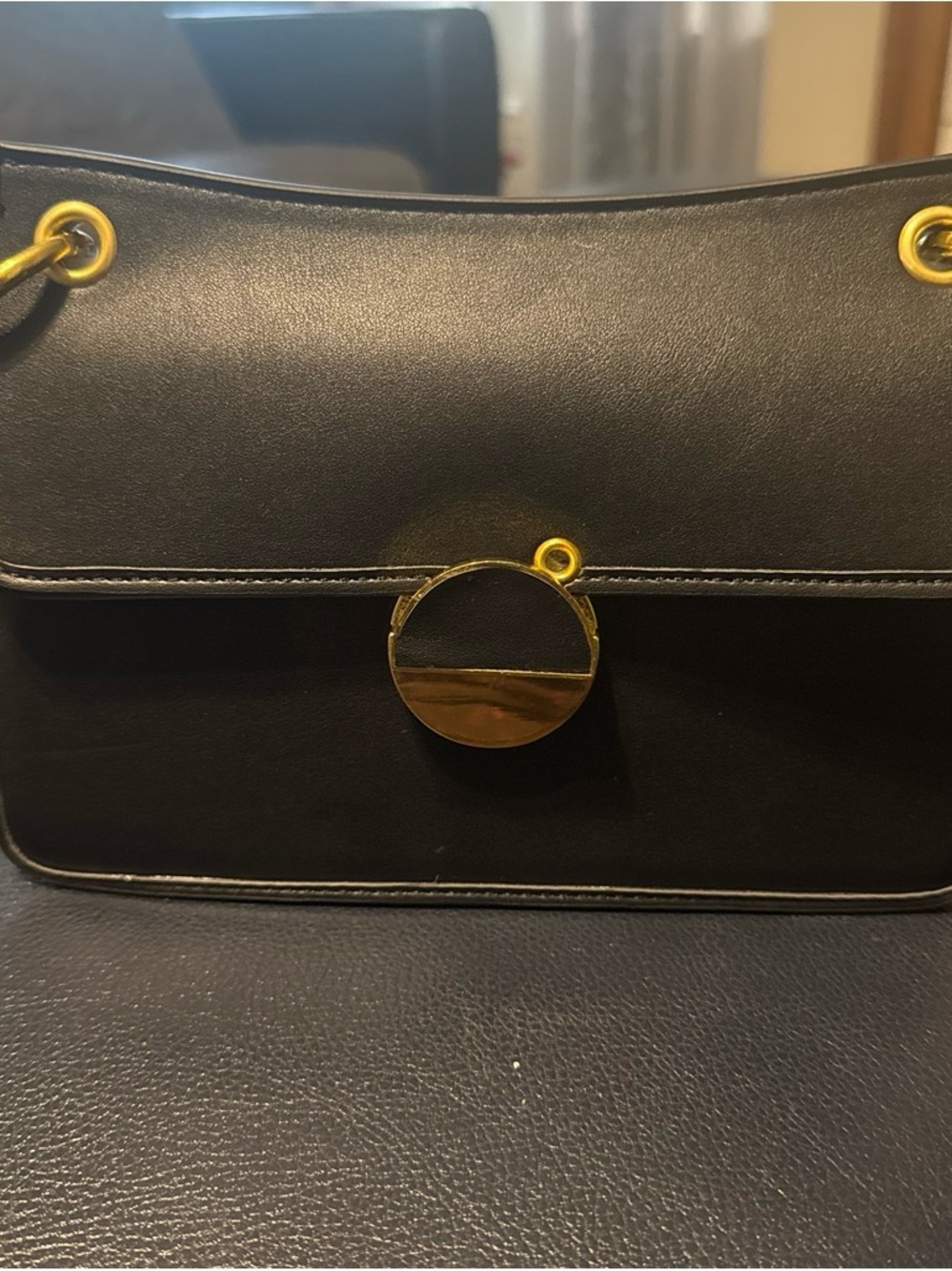 Classic Black Leather Shoulder Bag with Gold Accent